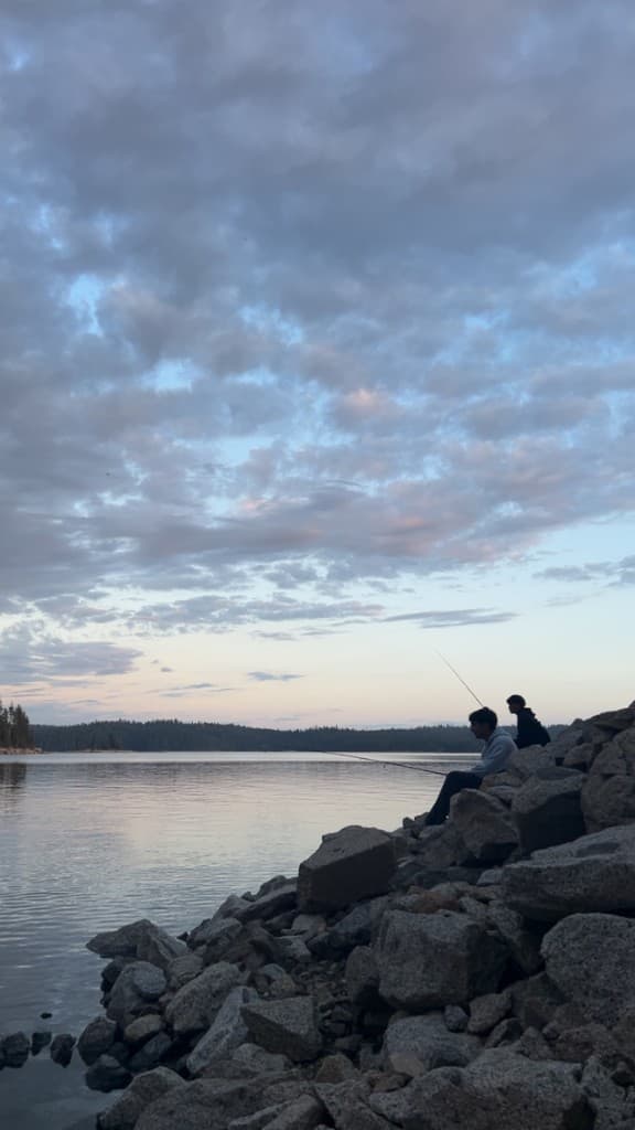 Fishing at the lake at dusk
