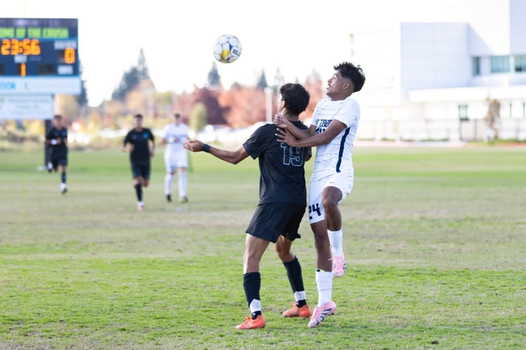 Amar competing for a header during a Crush soccer match
